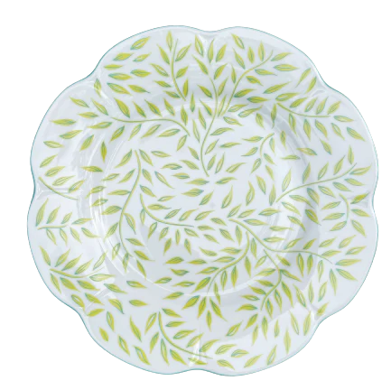 Olivier dessert plate in spring design, featuring a white background with green leaf patterns and a scalloped edge.