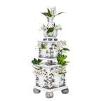 Tulipiere tower set in flint grey, featuring three stacked vases with floral arrangements and intricate landscape designs.