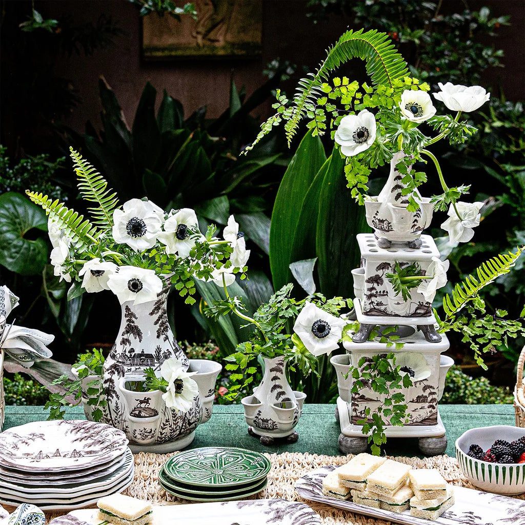 Tulipiere tower set in flint grey, featuring three vases with white flowers and greenery on a table setting.