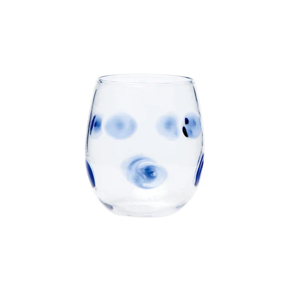 Drop blue stemless wine glass with a clear body and blue polka dots, designed for casual dining.
