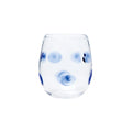 Drop blue stemless wine glass with a clear body and blue polka dots, designed for casual dining.