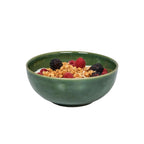 Puro cereal bowl in basil color filled with granola and mixed berries.