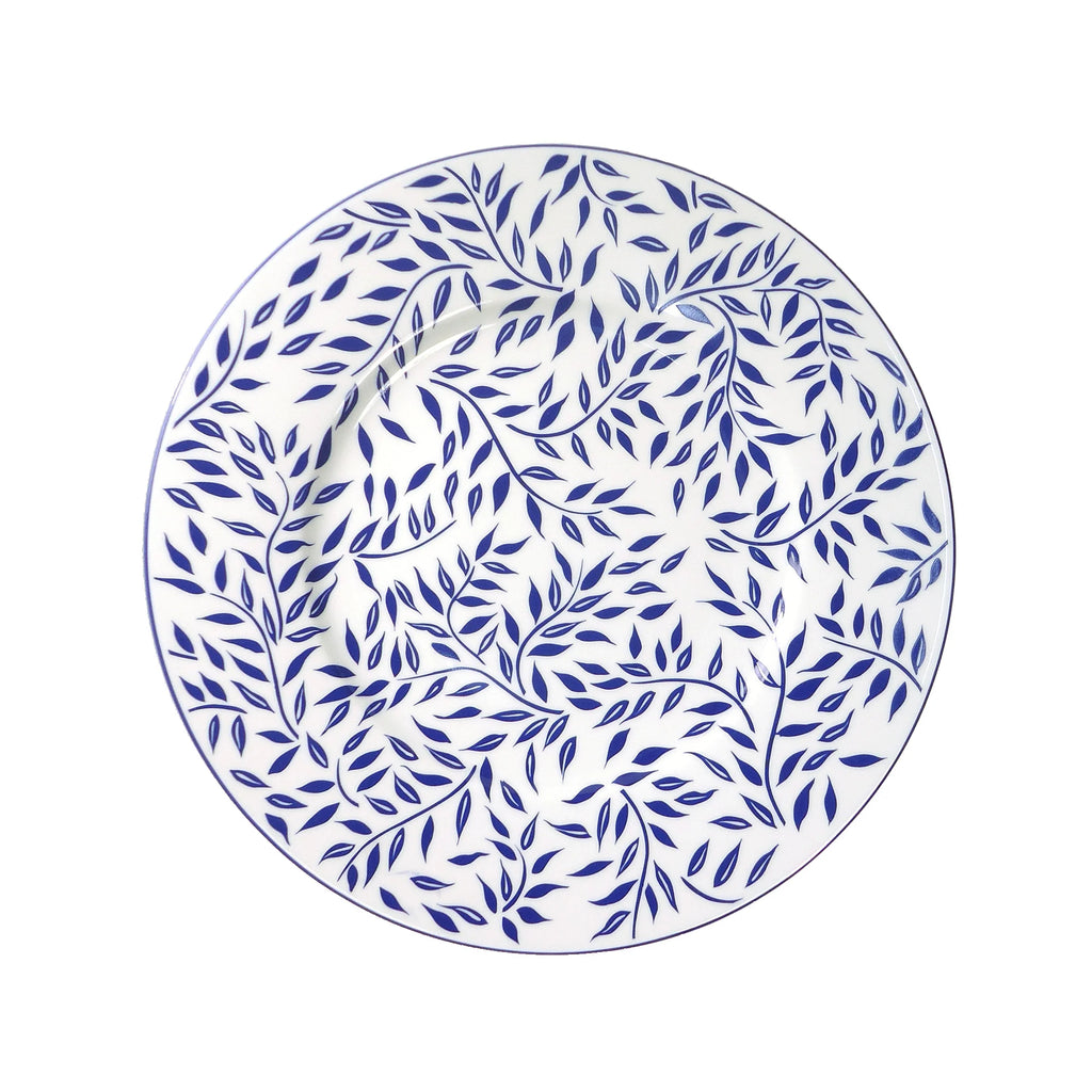 Olivier charger plate in blue featuring a leaf pattern on a white background.