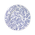 Olivier charger plate in blue featuring a leaf pattern on a white background.