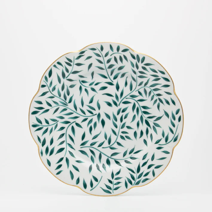 Olivier dinner plate in green with leaf pattern and gold scalloped edge on a white background.
