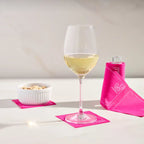 Clear Cocktail Napkin Stand with Pink Napkins by Table Theory