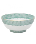 Green lace round serving bowl with intricate turquoise and white patterns and a gold rim, displayed at an angle.